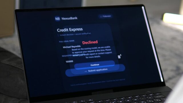 Online bank loan application process on a laptop. A user applies for a 100,000 dollars credit express loan and gets rejected due to a low credit score. Concept of financial crisis, debt, and digital