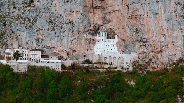 Cinematic footage of the famous Ostrog Monastery in Montenegro. Built into a dramatic cliffside, this iconic Orthodox monastery is one of the most important pilgrimage sites in the Balkans.