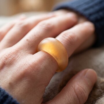 Biofeedback mood ring with waxy translucent texture and glow