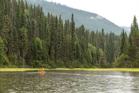 Canada, BC, Bowron Lake Provincial Park.  A lone canoe on Indianpoint Lake on the popular Bowron Lakes canoe circuit.