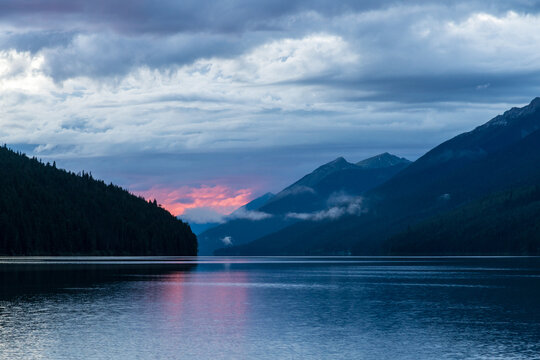 Canada, BC, Bowron Lake Provincial Park.  Distant sunset over Isaac Lake. Bowron Lakes, on the western slopes of the Cariboo Mountains is a popular canoe circuit.