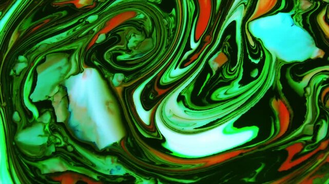 Close-up of glowing green bacteria swirling in liquid under ultraviolet light