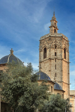 Miguelete bell tower of Valencia Cathedral in Spain. Vertical view, gothic architecture, clear blue sky, sunny daylight
