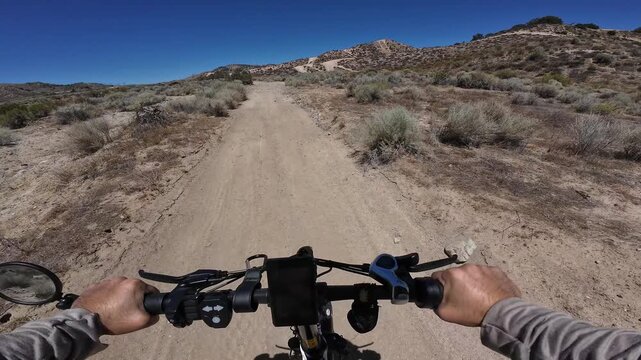 Dirt Bike and Electric Mountain Bike POV Shot of Hungry Valley Roadrunner Trail 2 Uphill in Southern California USA