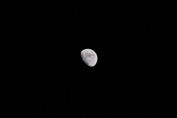 Fototapeta premium Waxing gibbous Moon on a dark evening sky.