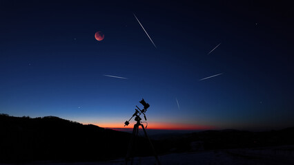 Fototapeta premium Amateur astrophotography equipment with camera, tripod star-tracker for photographing stars, planets and Moon.