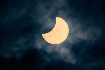 Fototapeta premium Solar eclipse view through a telescope and a special solar filter.