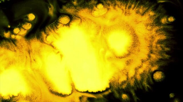 Abstract Yellow Ink Spreading and Blooming in Water, Macro Close-up Fluid Dynamics
