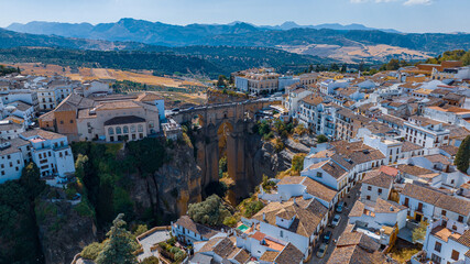 Obraz premium Aerial photograph of a bridge and streets, facades of old houses in a town in Spain, in Europe, a place with culture, history and tradition