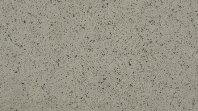 Granite texture background with small multicolored speckles and natural stone pattern