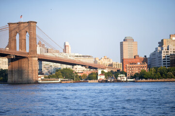 Fototapeta premium Serene Cityscape Scene. Peaceful Urban Sunset Featuring Stone Arches And Gentle Water new york