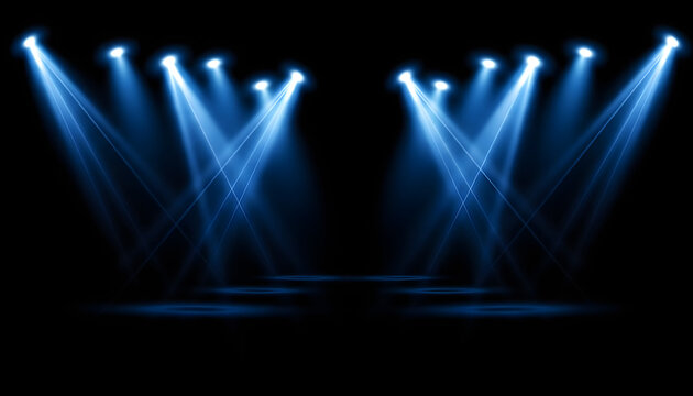 Bright blue spotlights illuminate a dark empty stage creating a dramatic atmosphere for musical performances or theatrical events that require high energy and visual impact