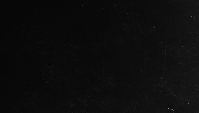 Black dirty wall texture with cinematic style.old wall texture background with subtle grain and dust.Distressed texture background for Movie poster,Streetwear and Urban fashion print.