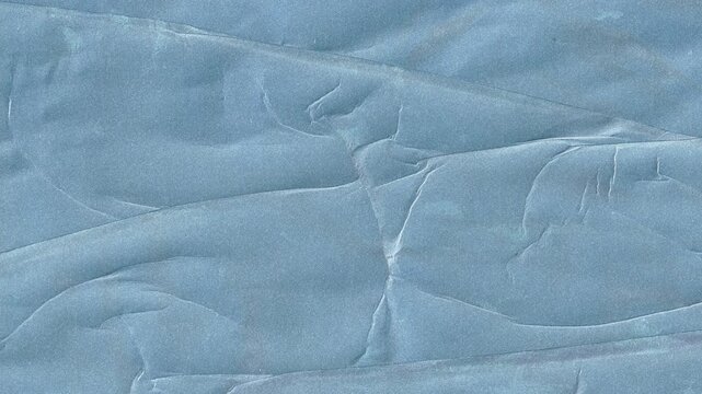 High quality motion graphic of blue crumbled paper texture featuring realistic creases and folds for artistic video backgrounds and vintage style digital storytelling applications.
