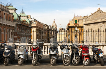 Naklejka premium Motorcycles parked over Genova downtown, Italy.