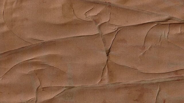 Animated brown wrinkled paper texture background with realistic creases and folds for vintage film overlays and creative stop motion art projects for video.
