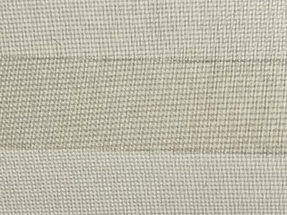 Fototapeta premium Neutral beige textile texture background with fine mesh pattern and horizontal stripes