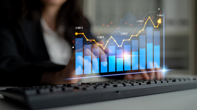 A business professional engages with a virtual chart symbolizing data growth and analytics in a contemporary office, highlighting strategy and technology use. Scalp