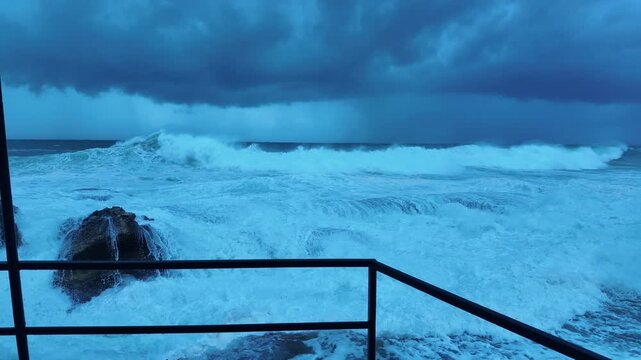 First-Person View from Flooded Rocky Shore &ndash; Massive Waves Surrounding Pier Corner During Extreme Tsunami Surge