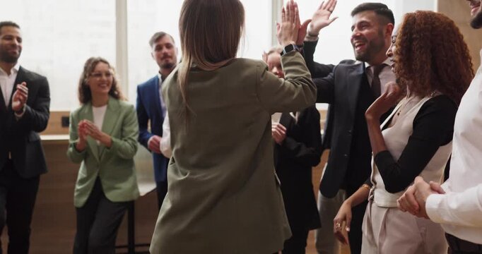 Business team people applause highfive success colleagues. Closeup professionals clapping as peers share a high five celebration in office. Concept highlights teamwork, unity, and recognition.