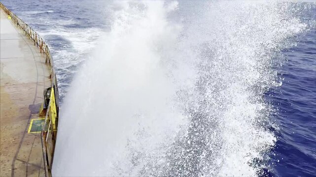 ocean waves thrown from ship bow. drops, spray of water.