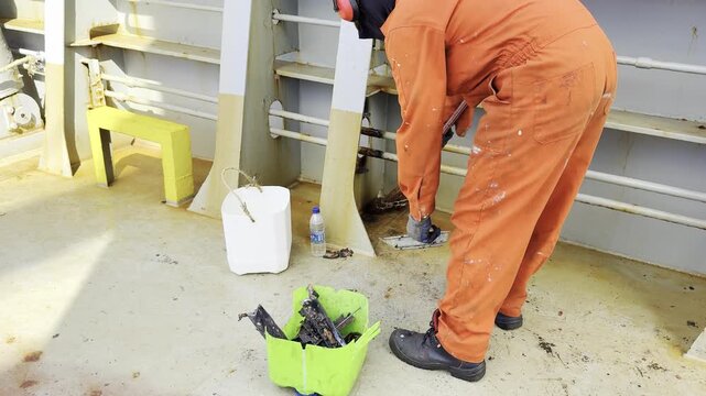 seafarer, crew member sweeping ship's deck, remove garbage