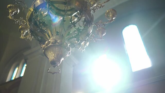 Radiant sunlight filters through ornate windows creating tranquil ambiance