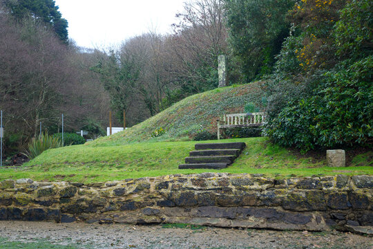 Idyllic rural scenery with empty wooden bench at English ria of Helford River on a winter day. Photo taken February 2026, Helford River, Cornwall, United Kingdom.
