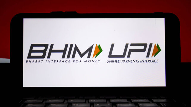 Bhim and upi logos on a smartphone screen, bharat interface for money and unified payments interface, digital payment system in india, mobile banking app