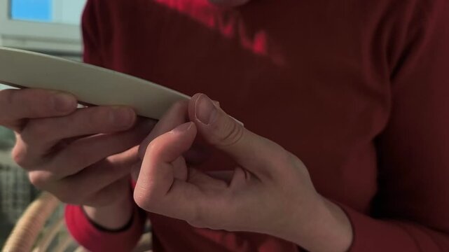 Hands filing nails with nail file, buffer close-up. beauty self care routine.