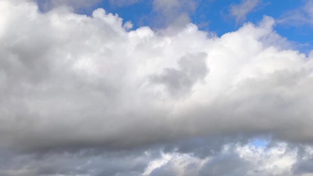 Angelic whitish clouds moving in the sky at sunset