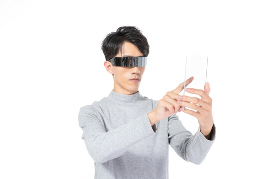 Man using transparent smartphone with futuristic visor