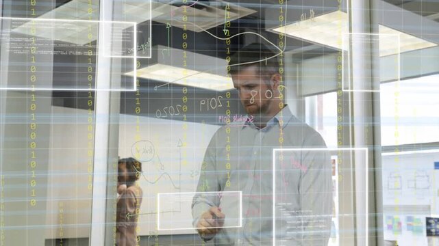 Man lifting pink marker and writing on glass, team planning on office whiteboard as overlays rising