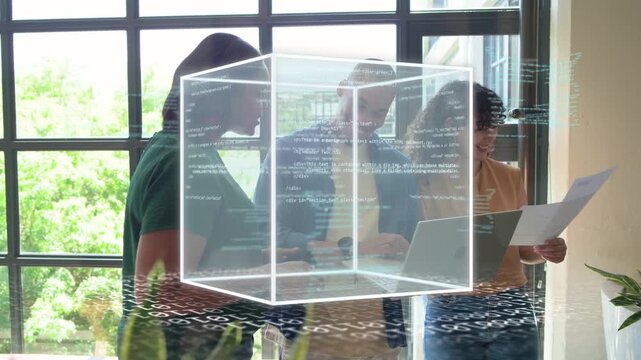 Three coworkers typing on laptop causing rotating 3D cube overlaying laptop with code for tech demo