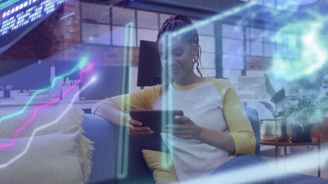 Woman on blue sofa tapping tablet and running AR overlays sweeping while checking tech and smiling