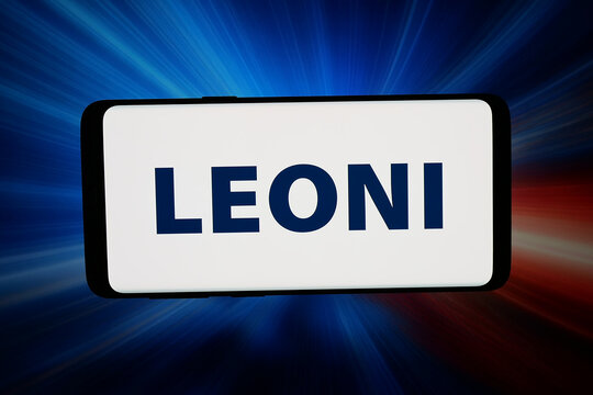 Stuttgart, Germany - 04-28-2026: In this photo illustration, the logo of German automotive company Leoni AG is displayed on a smartphone in front of abstract background on computer screen.