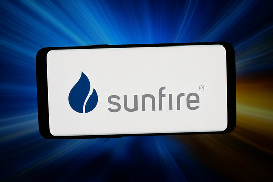 Stuttgart, Germany - 04-28-2026: In this photo illustration, the logo of German hydrogen company Sunfire SE is displayed on a smartphone in front of abstract background on computer screen.