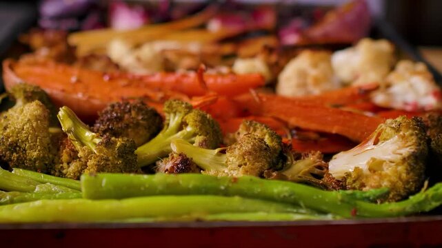 Panorama of appetizing roasted vegetables for Sunday roast. Close up of beetroot parsnip and carrot. Healthy homemade family dinner food
