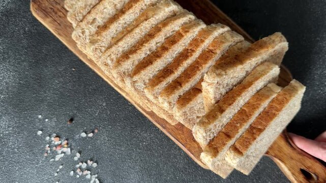 Whole-grain bread fresh baked goods, fluffy bread slices tasty snack fresh, delicious, gourmet food background on the table rustic food, top view copy space
