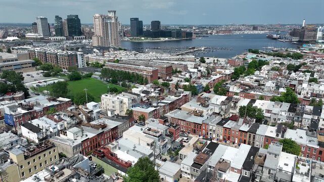 Riverside, Maryland, USA - June 9, 2025: A historic church stands alongside row houses in the beautiful Riverside neighborhood.