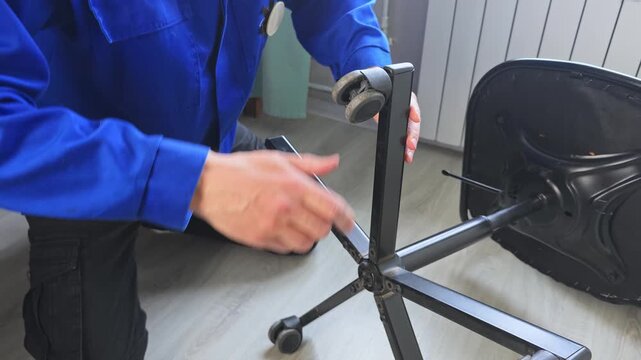 Master fixes office chair in simple steps at workshop in 2023