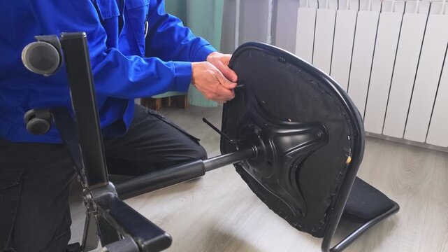 Master repairs office chair by fixing seat and base in simple steps