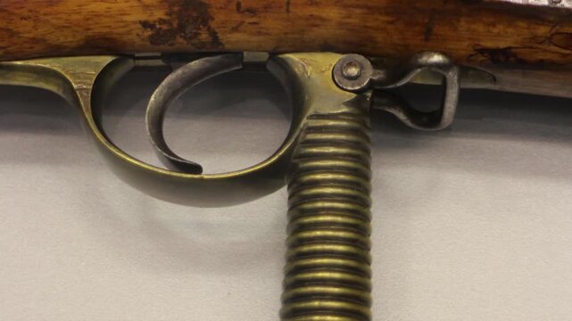 trigger of an old flintlock gun produced a spark and ignited the powder charge, the weapon was called a flintlock