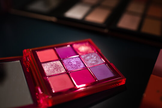 Shimmering pink eyeshadow palette with glitter close up