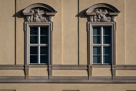 Classical twin windows with ornate pediments