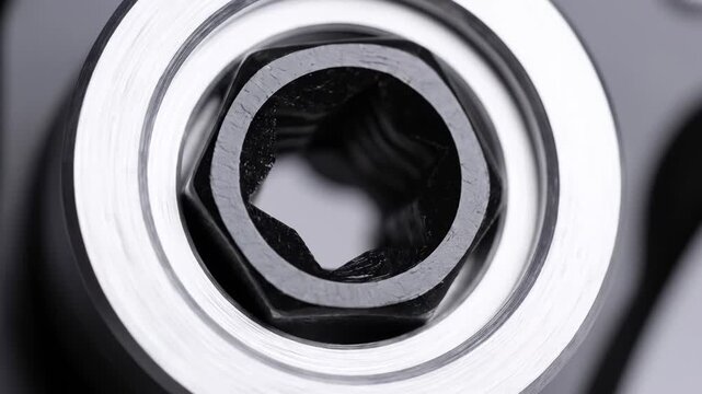 Extreme Close Up of Industrial Metal Socket Wrench Head Showing Internal Texture and Shape.