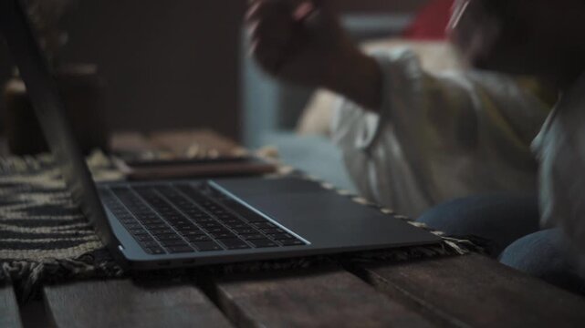 Close-up of an anonymous woman&rsquo;s hands typing angrily on a laptop keyboard. Frustration, stress, and remote work problem concept.