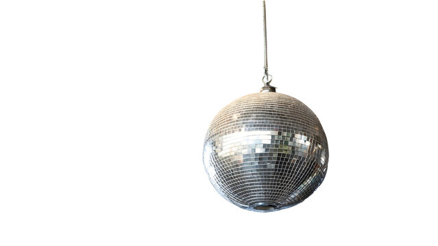 A shiny silver disco ball hangs from a string on white background with bright reflections