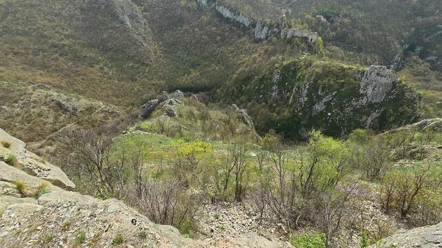 Rugged mountains rise above rocky terrain. Mount Ozren, Sokobanja, Serbia
