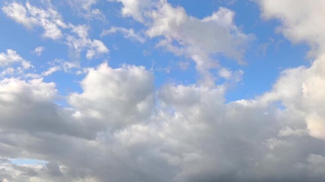 Beautiful cirrocumulus clouds moving together at sunset